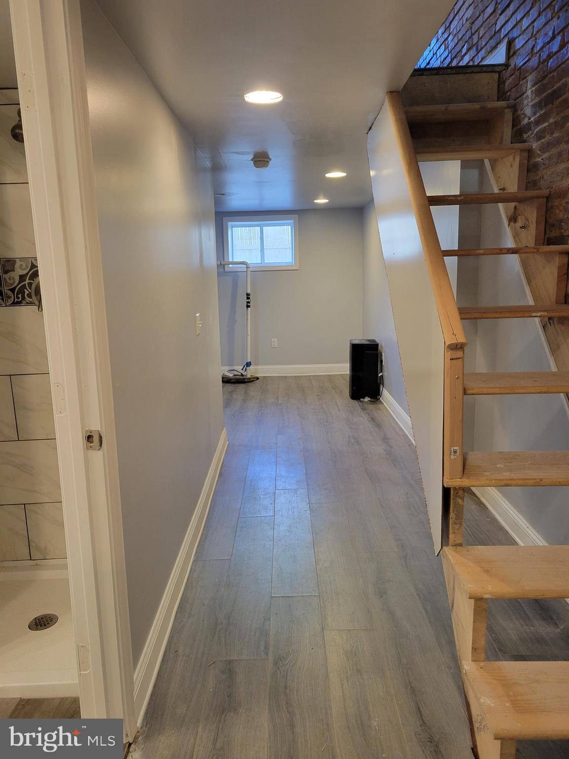 917 North Rose Street Baltimore, MD 21205 - Photo 25 of 34 a view of a hallway with wooden floor and staircase