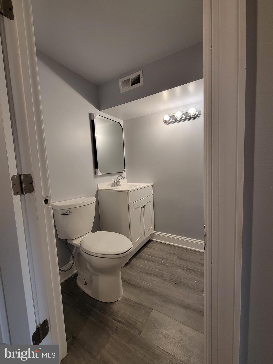 917 North Rose Street Baltimore, MD 21205 - Photo 26 of 34 a white toilet sitting next to a sink