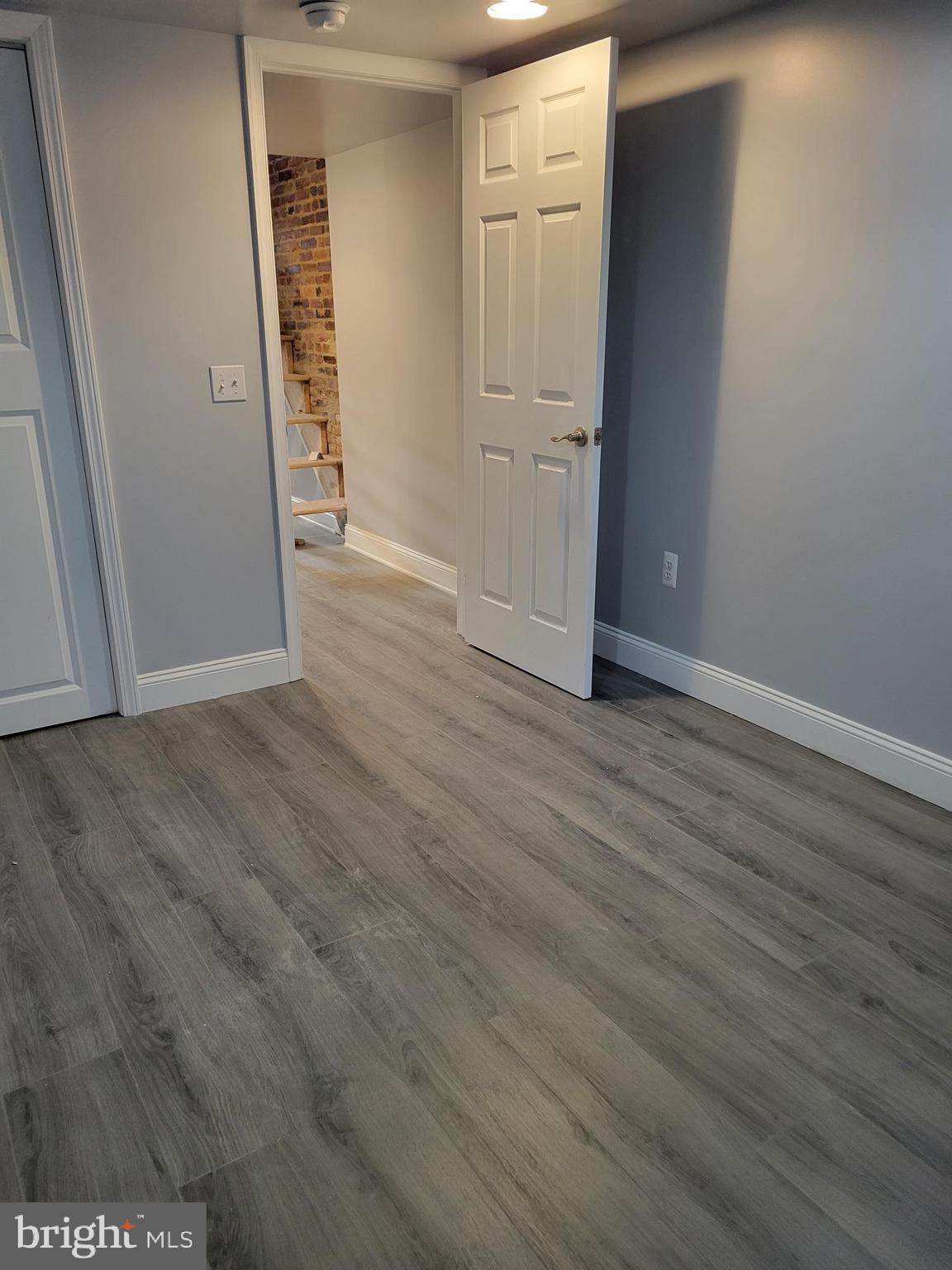 917 North Rose Street Baltimore, MD 21205 - Photo 28 of 34 an empty room with wooden floor