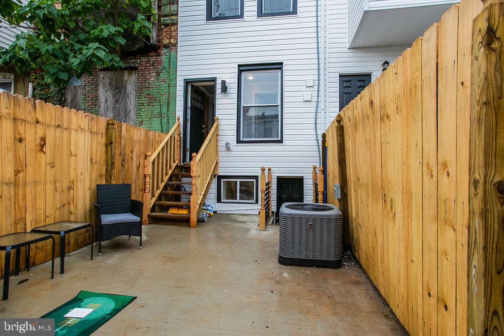 917 North Rose Street Baltimore, MD 21205 - Photo 32 of 34 a view of a deck with furniture and a yard
