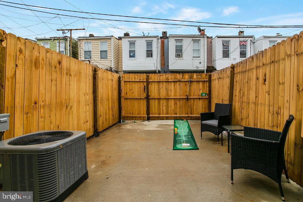 917 North Rose Street Baltimore, MD 21205 - Photo 34 of 34 a backyard of a house with outdoor seating