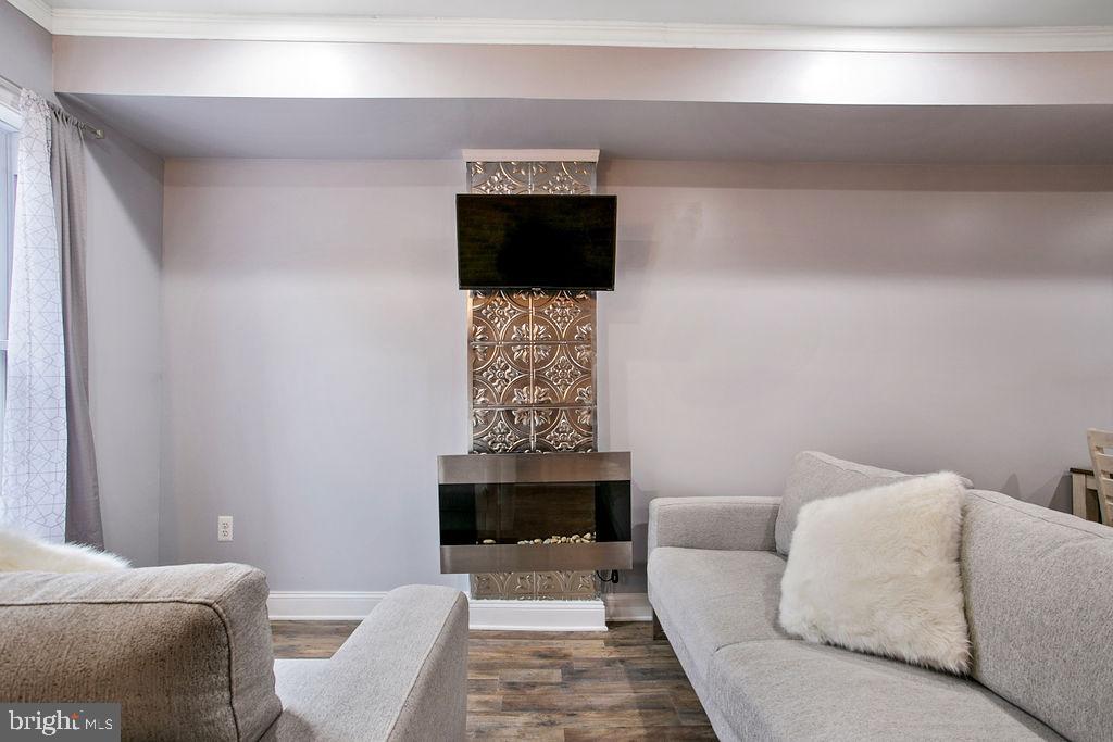 917 North Rose Street Baltimore, MD 21205 - Photo 5 of 34 a living room with furniture and a fireplace