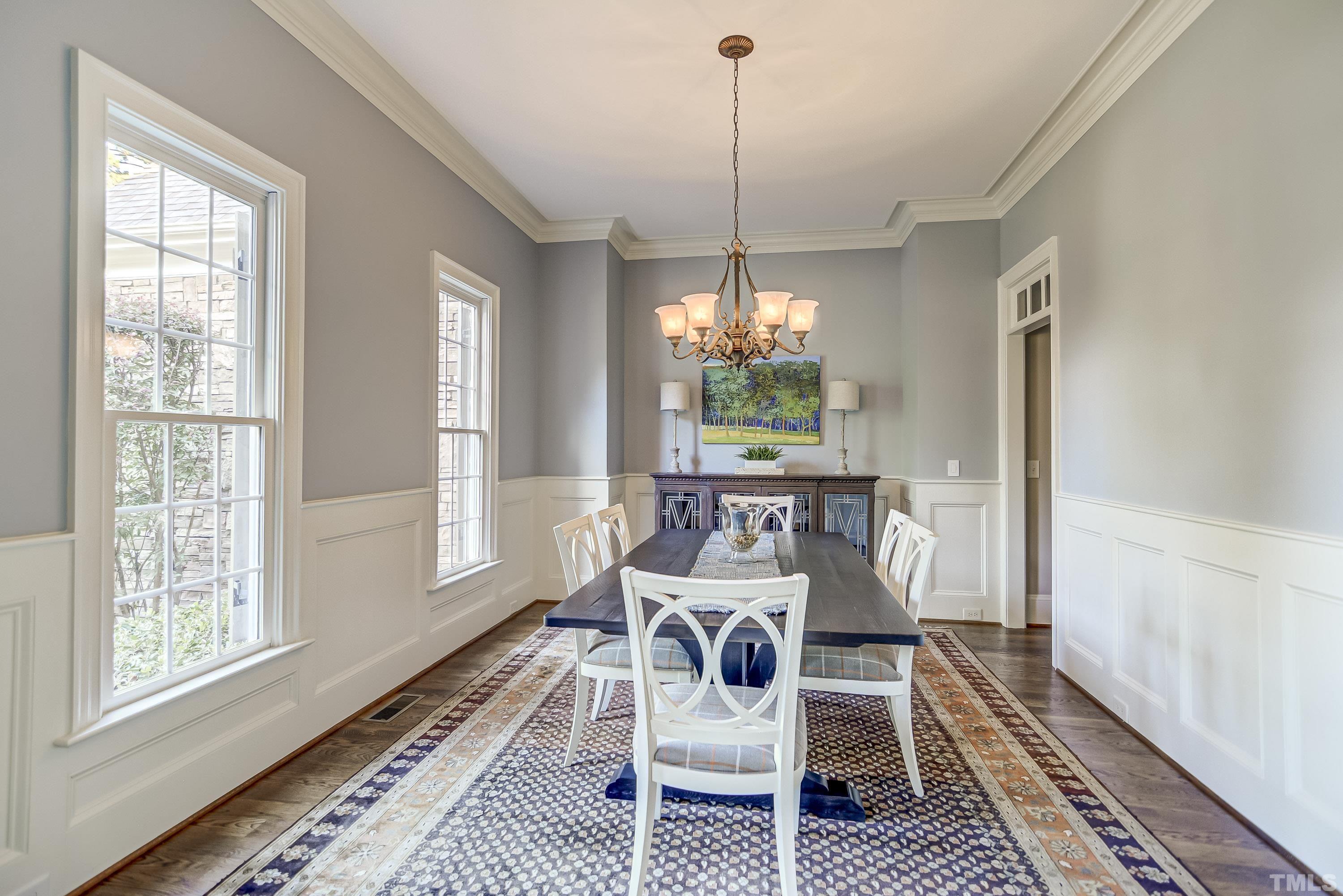 1520 Consett Court Raleigh, NC 27613 - Photo 3 of 30 a dining room with furniture a chandelier and wooden floor
