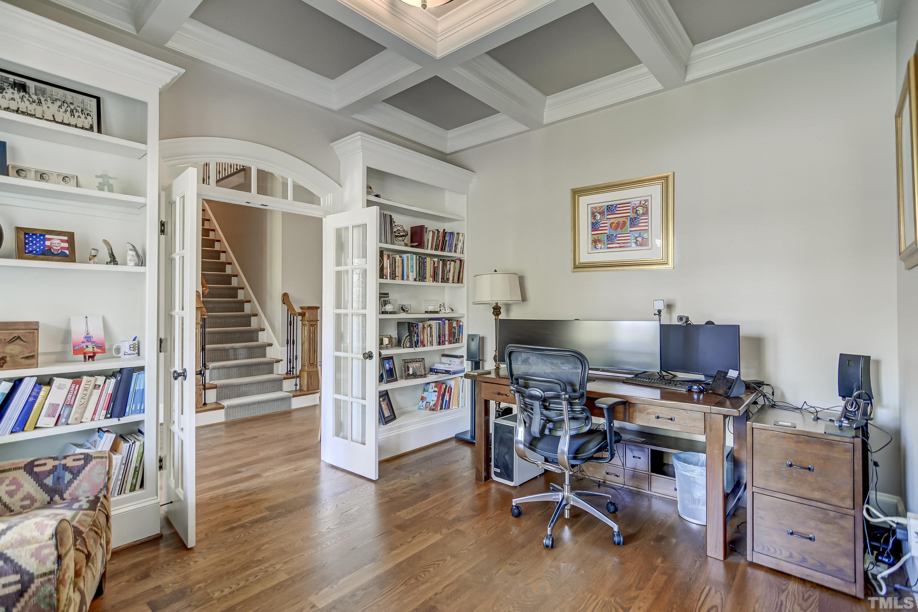 1520 Consett Court Raleigh, NC 27613 - Photo 4 of 30 a view of a workspace with furniture and wooden floor