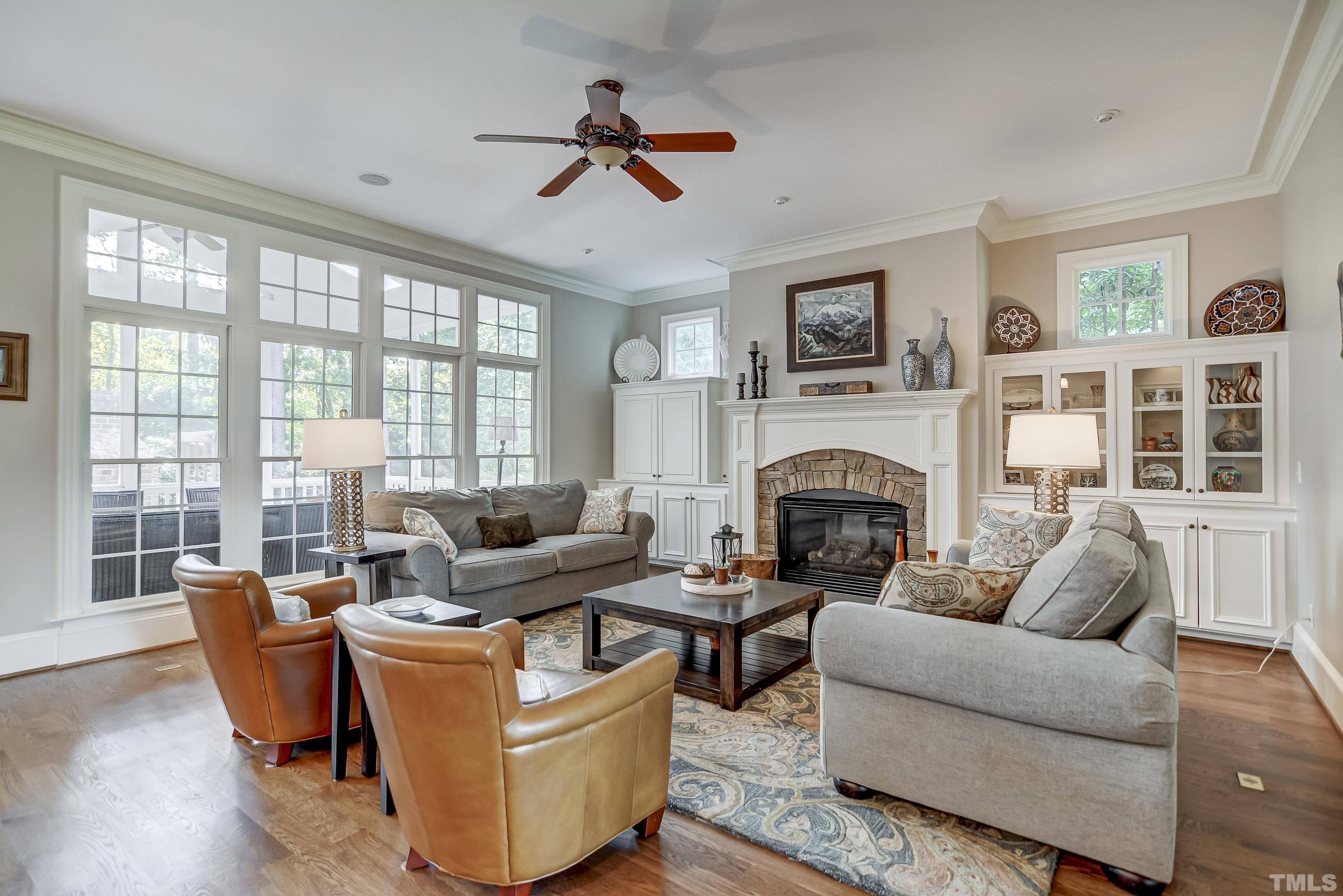 1520 Consett Court Raleigh, NC 27613 - Photo 5 of 30 a living room with furniture fireplace and a large window