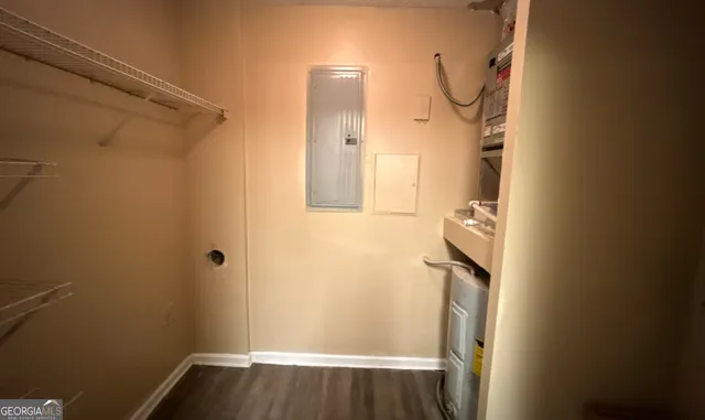 view of small space with wooden floor and mirror