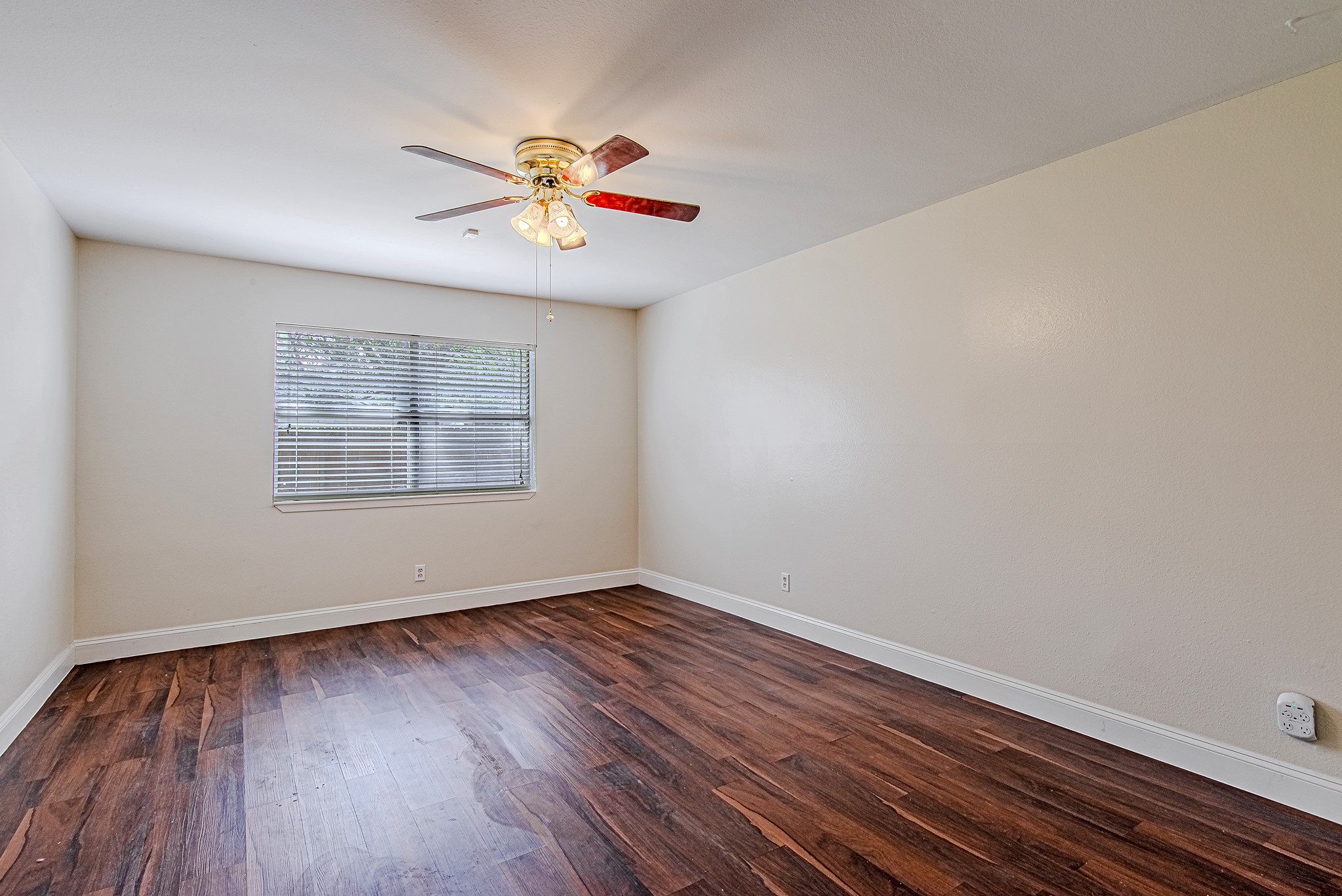 17811 Hawk Haven Lane Spring, TX 77379 - Photo 12 of 24 Primary bedroom with rich flooring, a generous layout, and natural light for a comfortable, private retreat. Ceiling fan has been updated since this photo was taken.