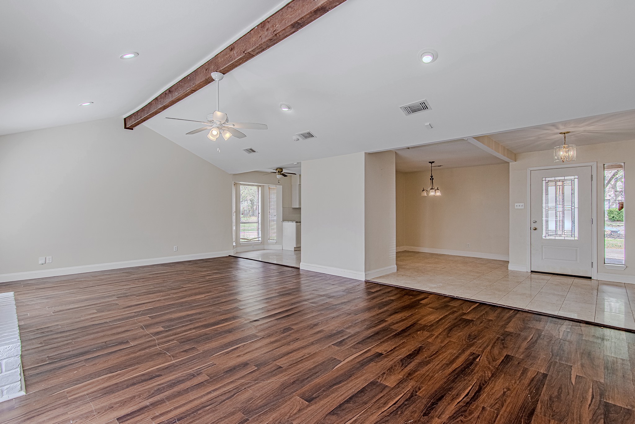 17811 Hawk Haven Lane Spring, TX 77379 - Photo 2 of 24 Another look at the expansive living room, emphasizing the home’s open-concept flow between the living area, kitchen, dining room, and entry. Ceiling fan has been updated since this photo was taken.