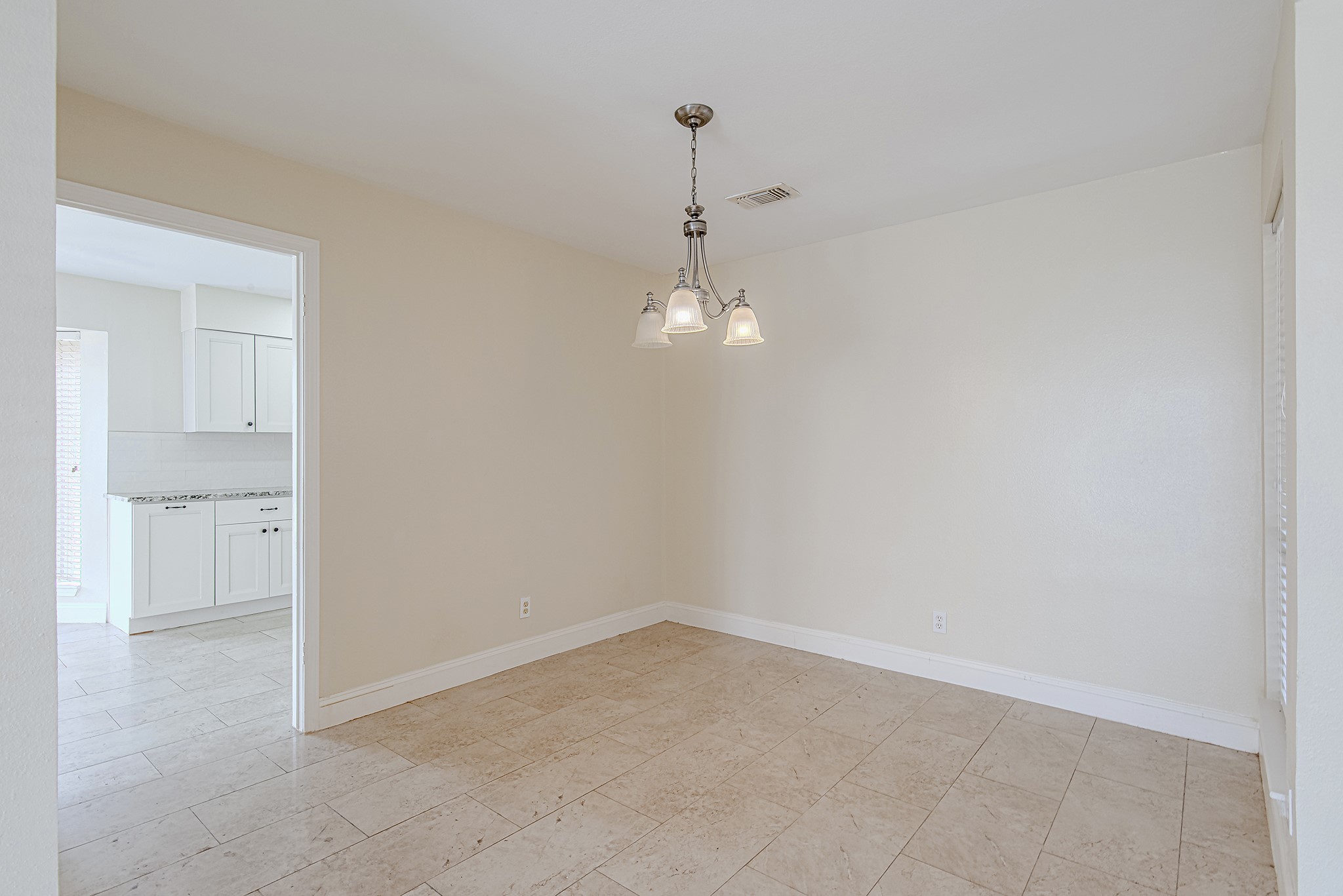 17811 Hawk Haven Lane Spring, TX 77379 - Photo 6 of 24 Dedicated dining room just off the entry, featuring tile flooring and an easy connection to the kitchen for seamless everyday living and entertaining.