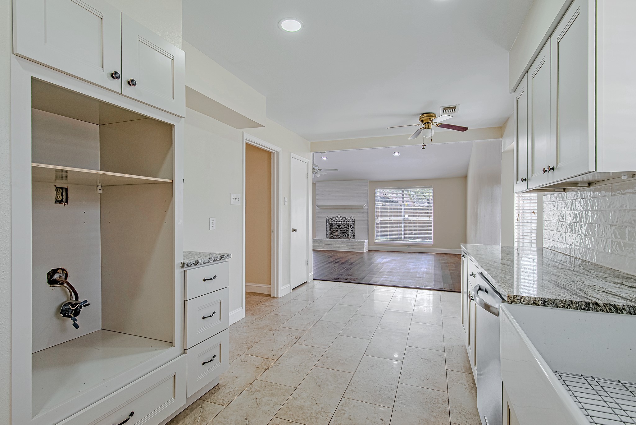 17811 Hawk Haven Lane Spring, TX 77379 - Photo 9 of 24 From the kitchen, this view looks out to the spacious living room and also captures the adjoining breakfast nook, highlighting the home’s open, connected layout. Updated light fixtures have been installed since this photo was taken.