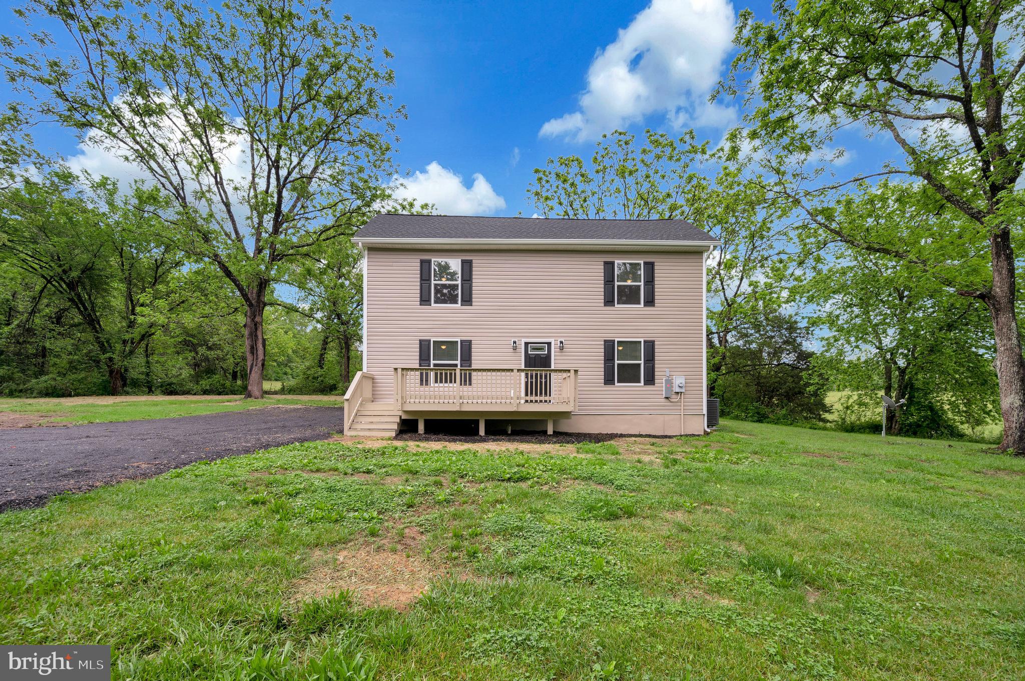 14169 Silver Hill Road Sumerduck, VA 22742 - Photo 37 of 40 a view of a house with a yard and sitting area