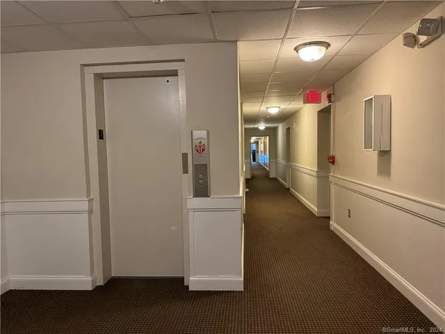a view of a hallway with an empty room