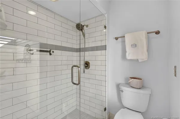 an aerial view of residential houses with outdoor space and swimming pool