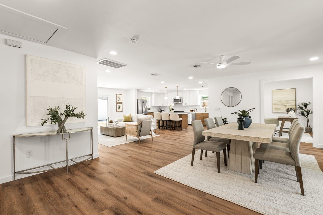 5207 Hummingbird Street Houston, TX 77035 - Photo 2 of 23 Bright open-concept layout connecting the dinning, living and kitchen areas with luxury vinyl plank flooring and recessed lighting