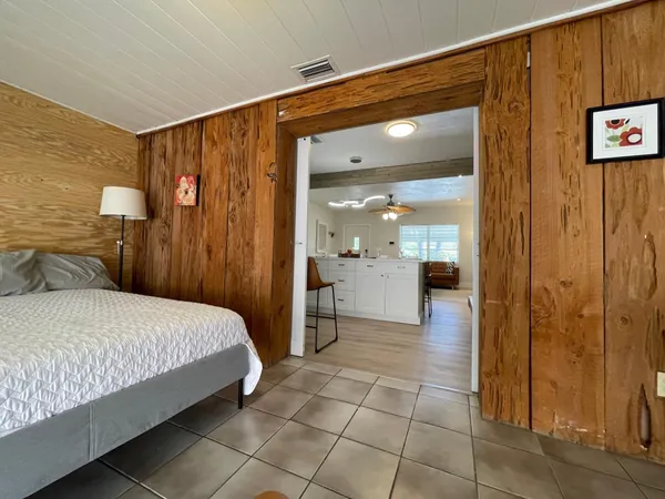 a bedroom with a bed and a view of bathroom
