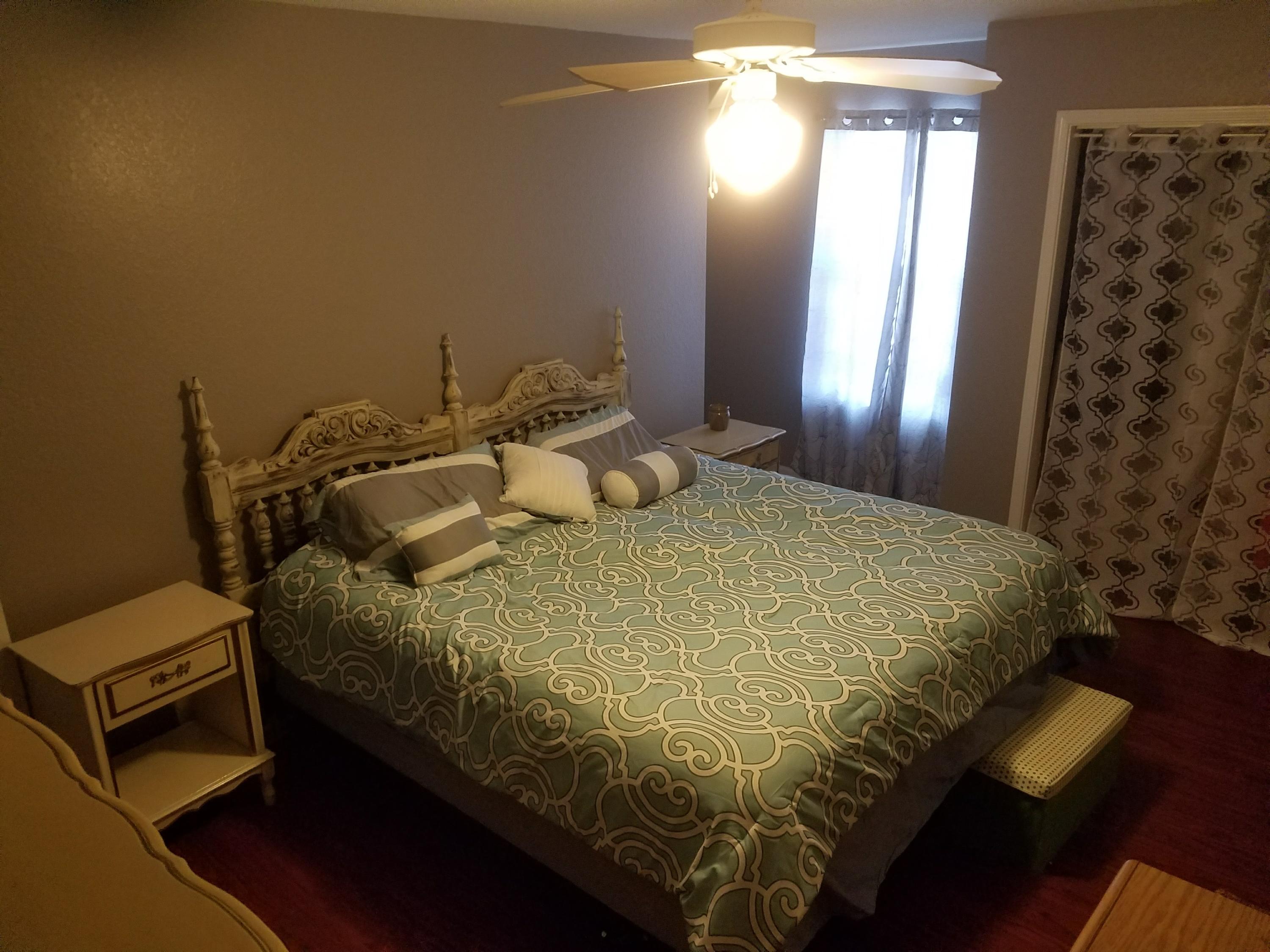 1014 Airport Road, Unit 105 Destin, FL 32541 - Photo 11 of 25 a bedroom with a bed and a window