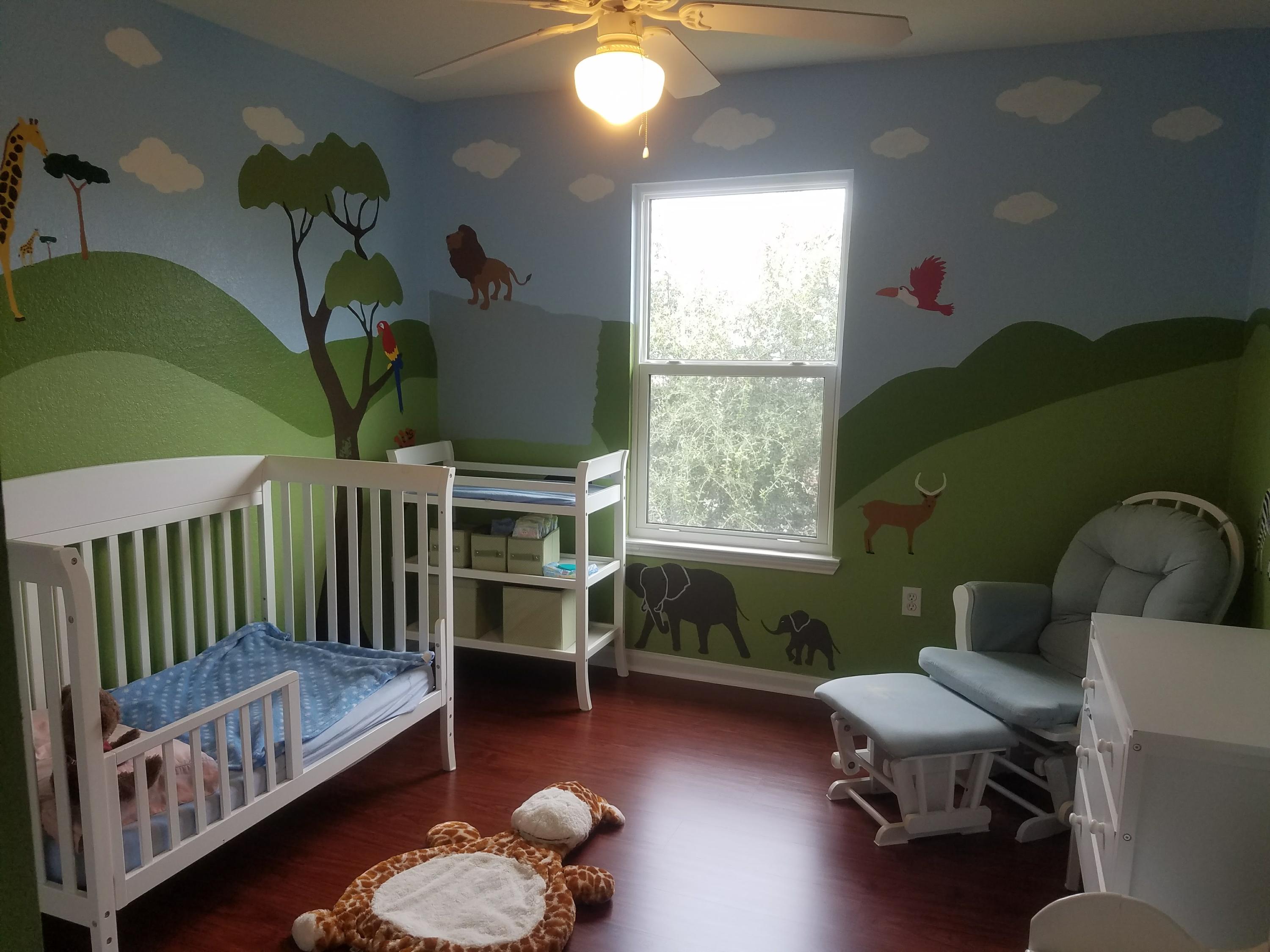 1014 Airport Road, Unit 105 Destin, FL 32541 - Photo 17 of 25 a bedroom with furniture and a wooden floor