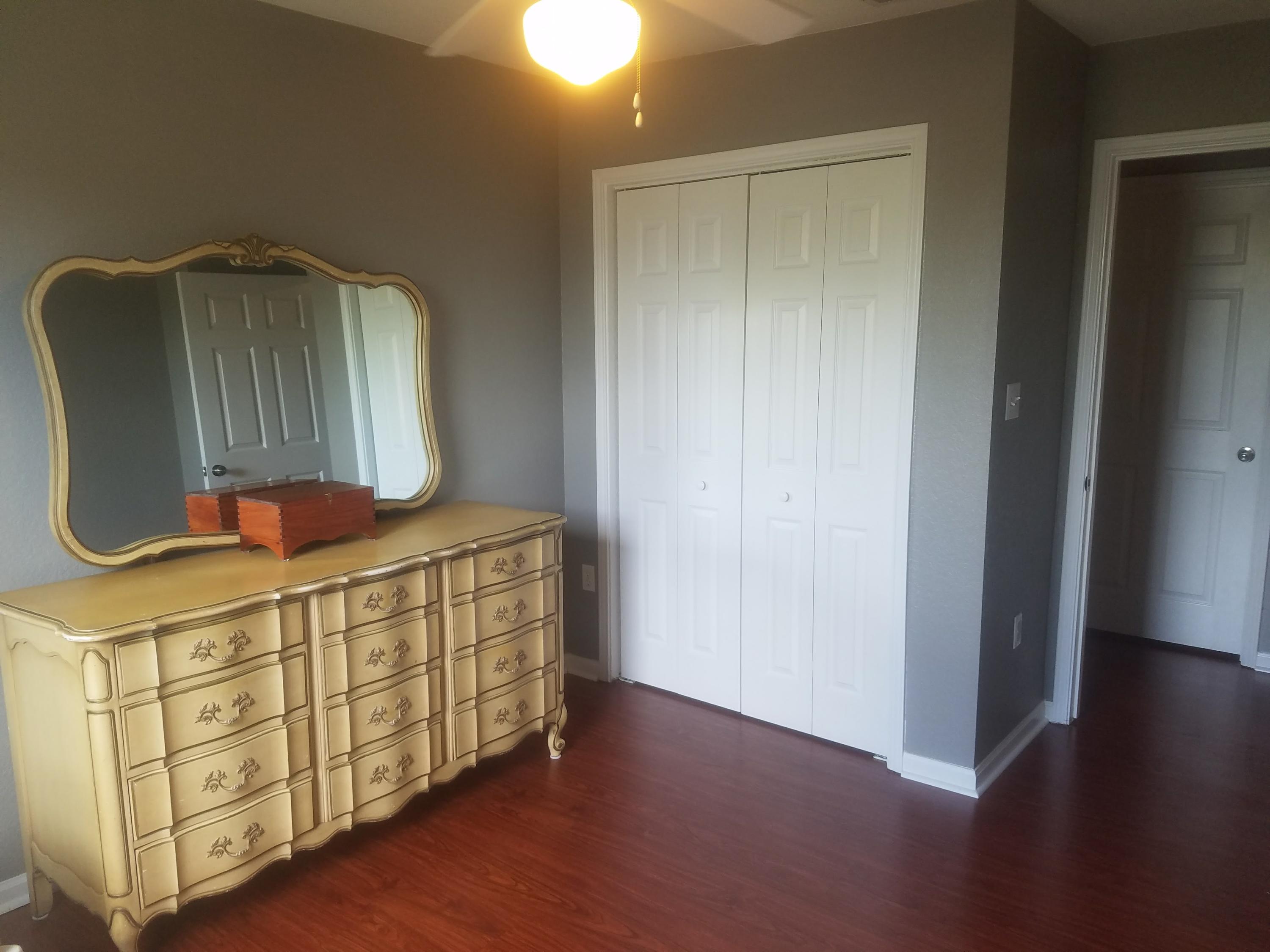 1014 Airport Road, Unit 105 Destin, FL 32541 - Photo 21 of 25 a bathroom with a double vanity sink and mirror