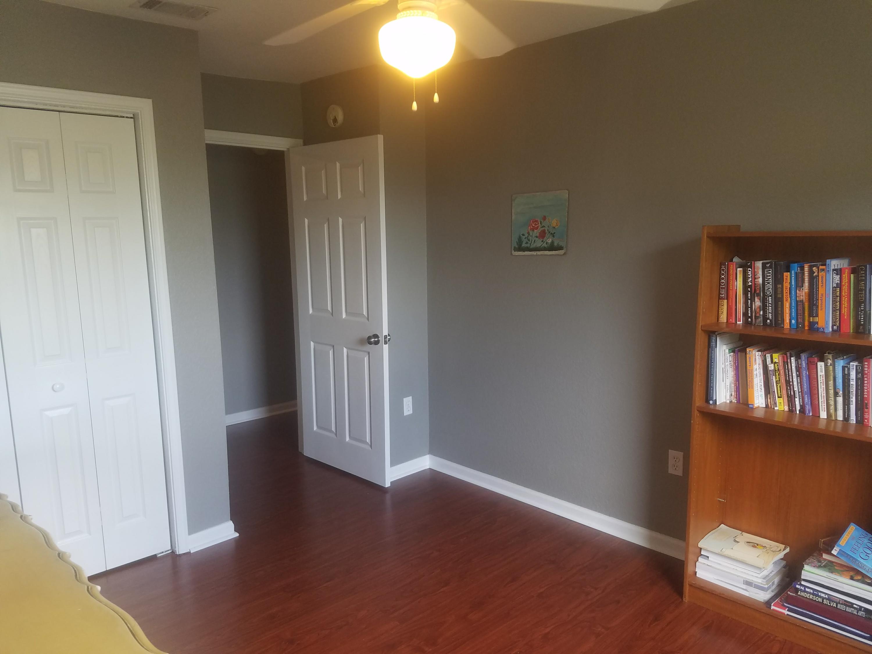 1014 Airport Road, Unit 105 Destin, FL 32541 - Photo 22 of 25 an empty room with wooden floor and closet