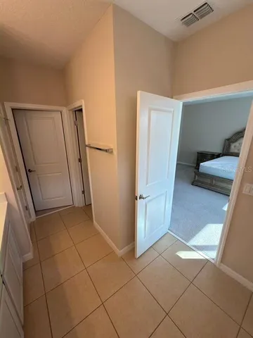 a bathroom with a sink mirror and a shower