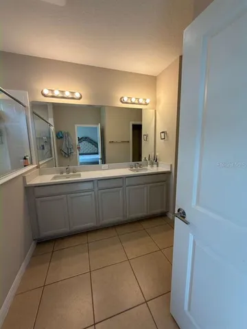 a view of a swimming pool with lounge chairs