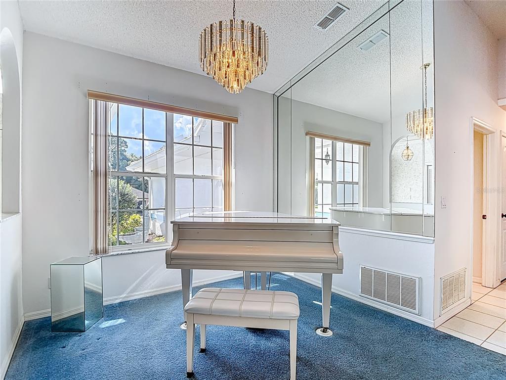 1039 Greenturf Road Spring Hill, FL 34608 - Photo 13 of 52 a living room with furniture and a window
