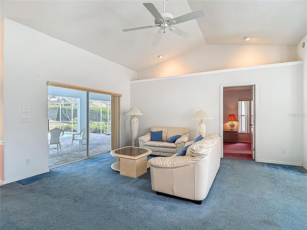 1039 Greenturf Road Spring Hill, FL 34608 - Photo 15 of 52 a living room with furniture and a window