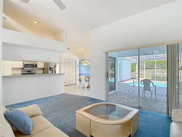 a living room with furniture and a table
