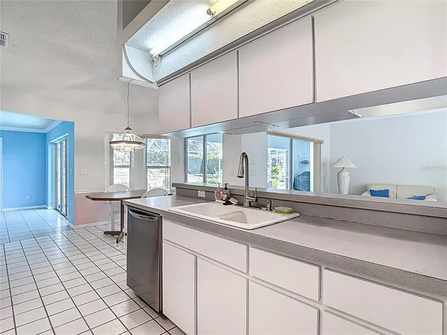 a view of a dining room with furniture wooden floor and chandelier