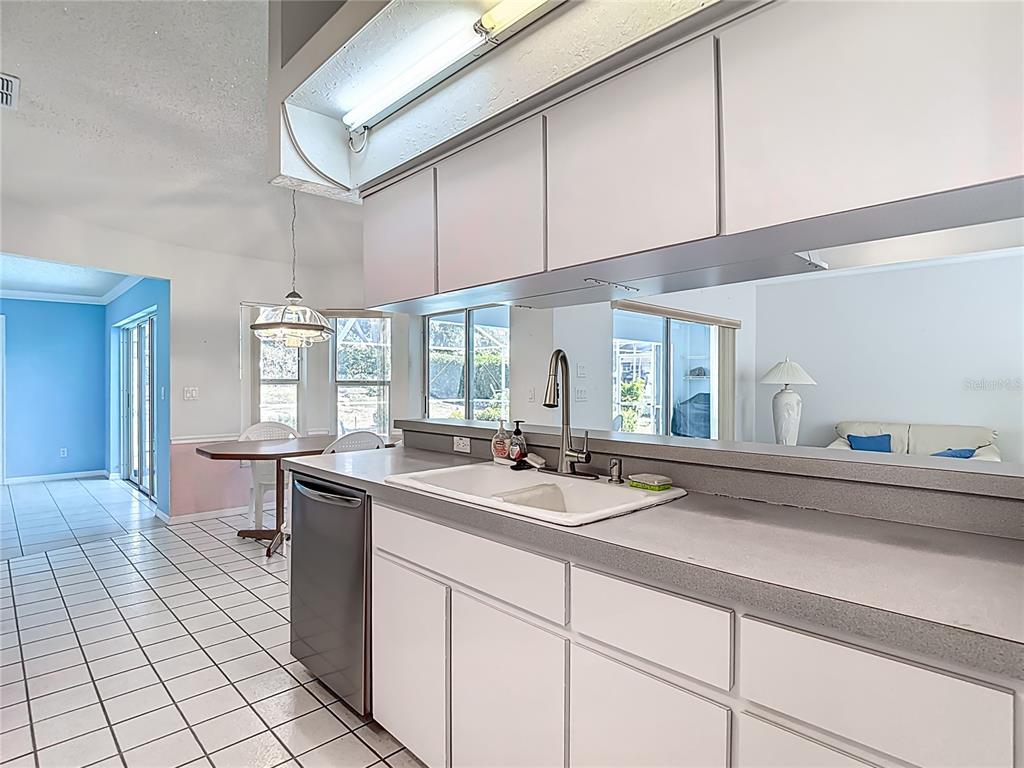 1039 Greenturf Road Spring Hill, FL 34608 - Photo 23 of 52 a spacious bathroom with a sink and a mirror