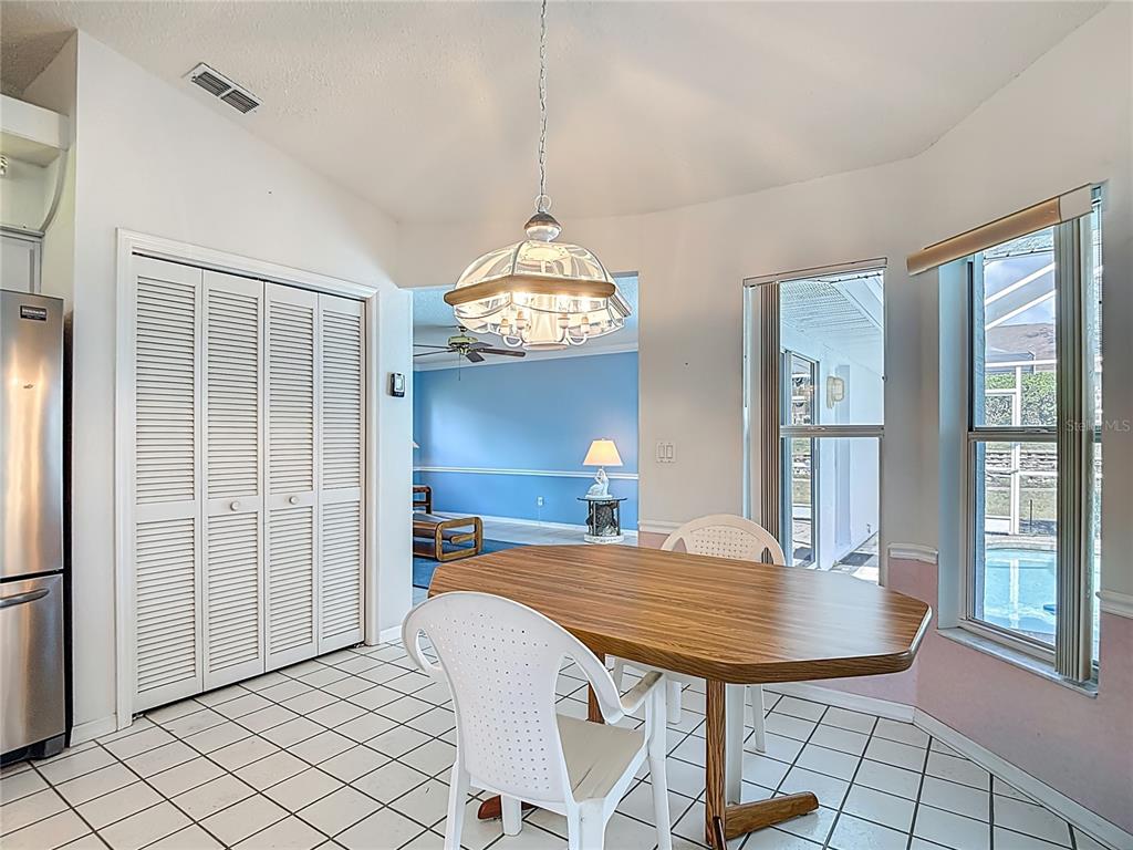 1039 Greenturf Road Spring Hill, FL 34608 - Photo 25 of 52 a view of a dining room with furniture