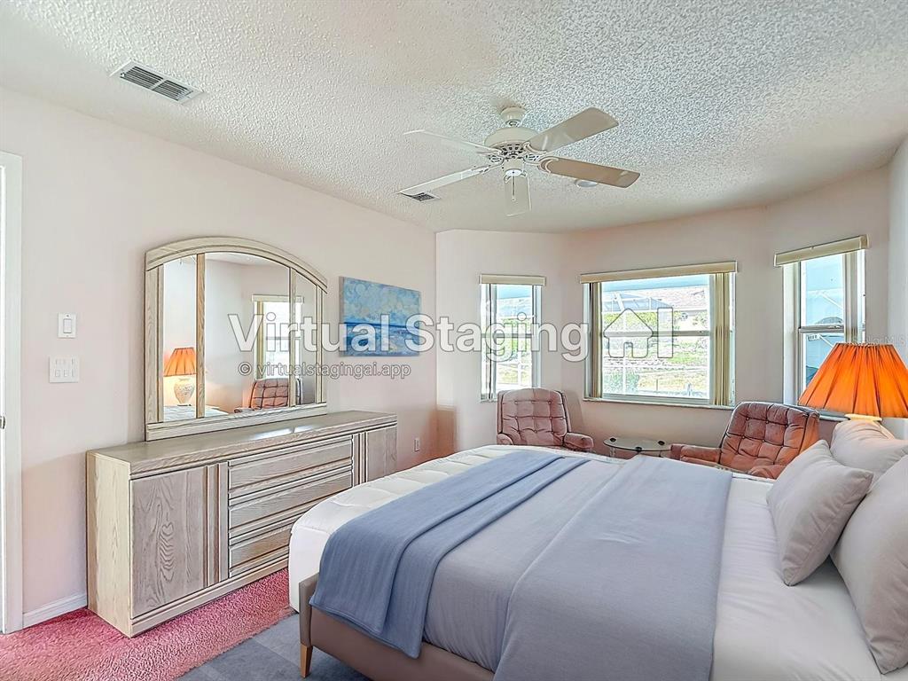 1039 Greenturf Road Spring Hill, FL 34608 - Photo 31 of 52 a bedroom with a large bed and a window