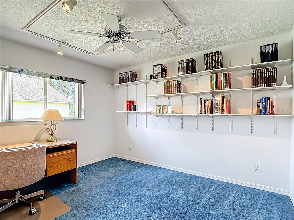 1039 Greenturf Road Spring Hill, FL 34608 - Photo 37 of 52 a workspace with furniture and window