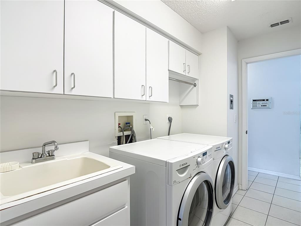 1039 Greenturf Road Spring Hill, FL 34608 - Photo 39 of 52 a utility room with dryer and washer