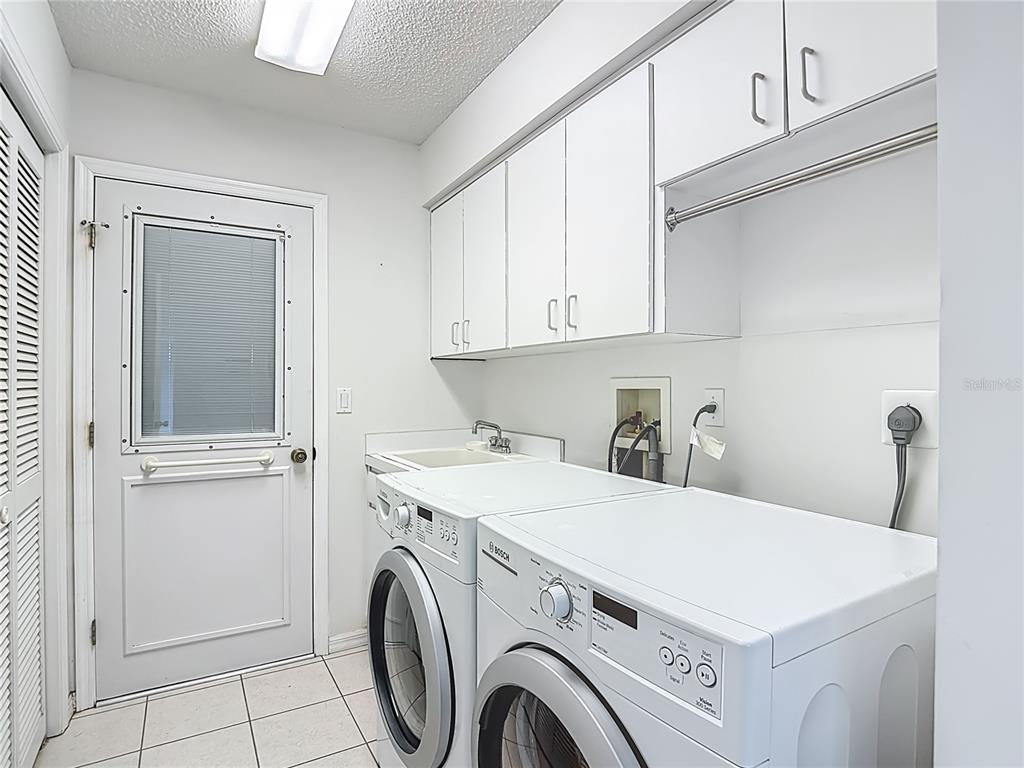 1039 Greenturf Road Spring Hill, FL 34608 - Photo 40 of 52 a utility room with dryer and washer