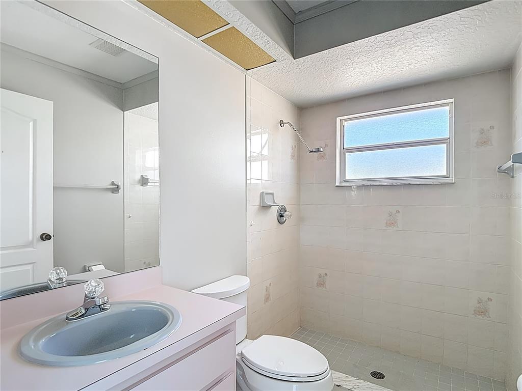 1039 Greenturf Road Spring Hill, FL 34608 - Photo 43 of 60 a bathroom with a sink toilet and shower