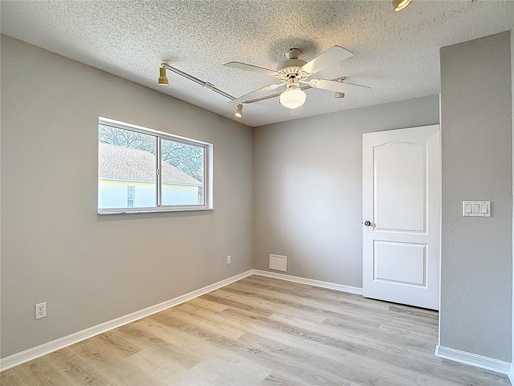 1039 Greenturf Road Spring Hill, FL 34608 - Photo 44 of 60 a view of an empty room with a window