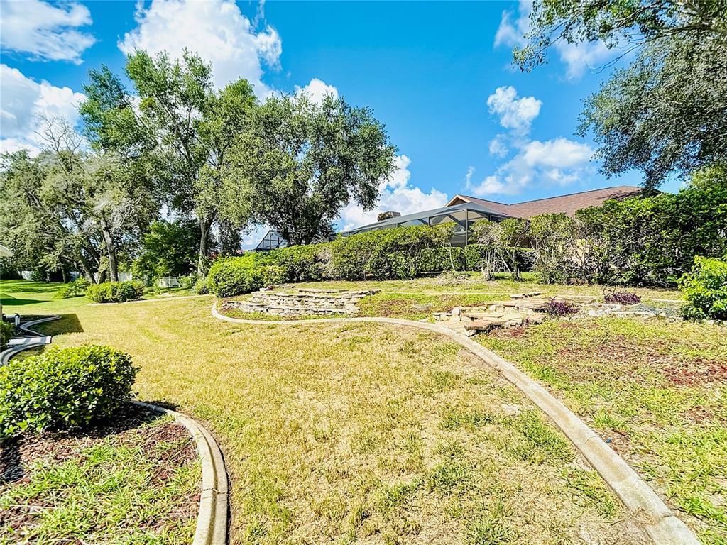 1039 Greenturf Road Spring Hill, FL 34608 - Photo 45 of 52 a view of an outdoor space and swimming pool