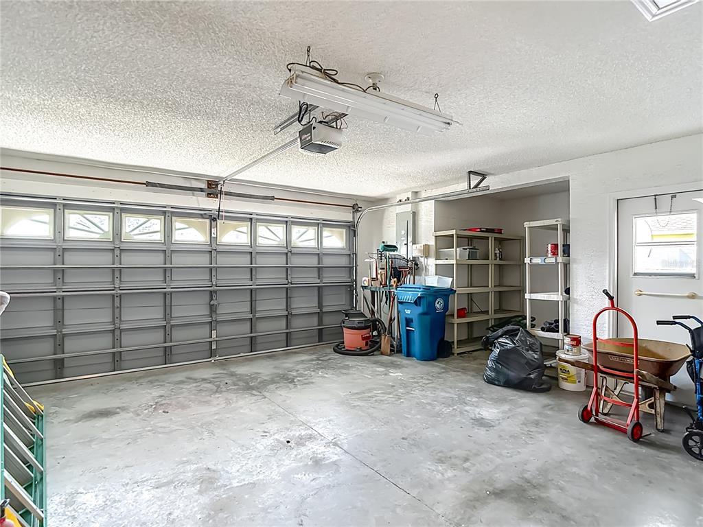 1039 Greenturf Road Spring Hill, FL 34608 - Photo 50 of 52 a view of a garage with furniture