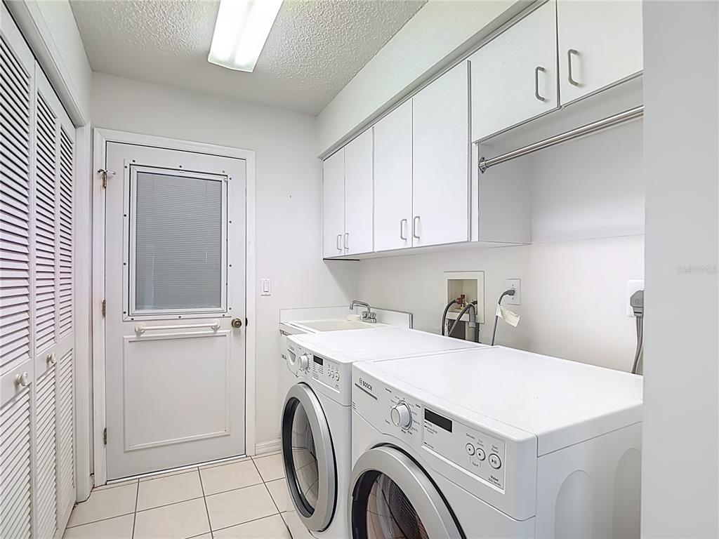 1039 Greenturf Road Spring Hill, FL 34608 - Photo 53 of 60 a utility room with dryer and washer