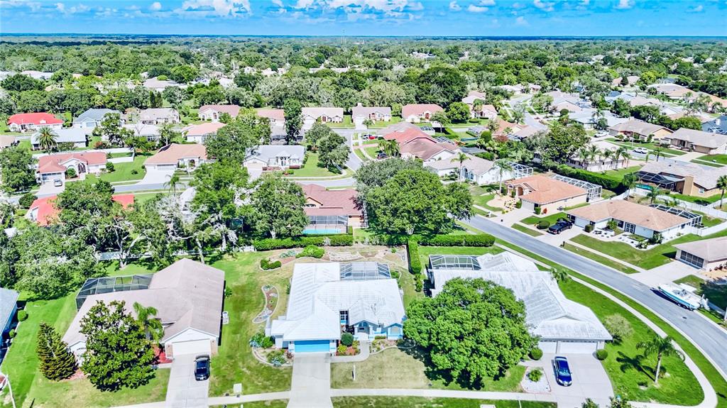 1039 Greenturf Road Spring Hill, FL 34608 - Photo 7 of 52 an aerial view of a house with a garden