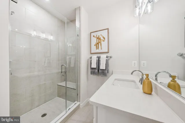 a bathroom with a sink and a shower