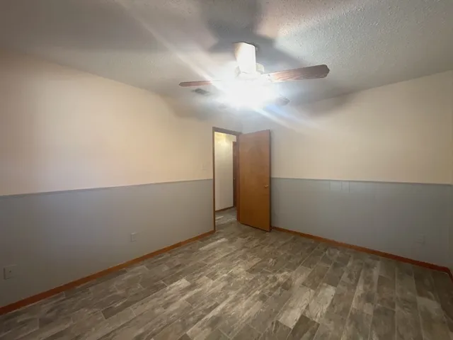a bathroom with a bathtub sink vanity and mirror