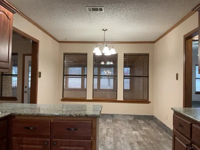 a view of granite countertop kitchen and granite counter top