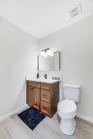 a view of a house with yard and tree s