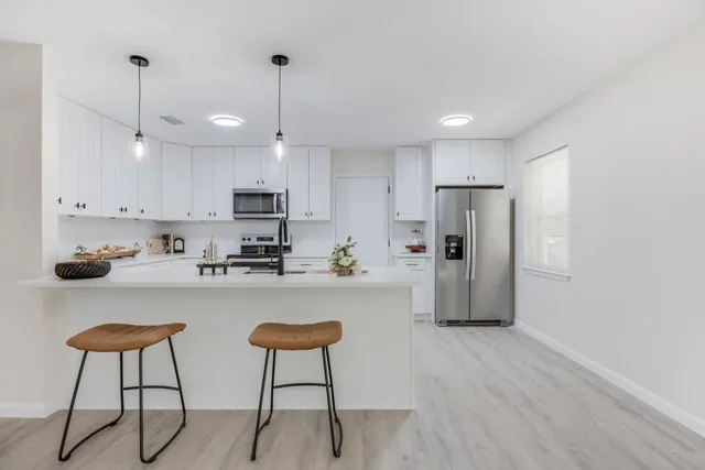 a kitchen with a sink and cabinets
