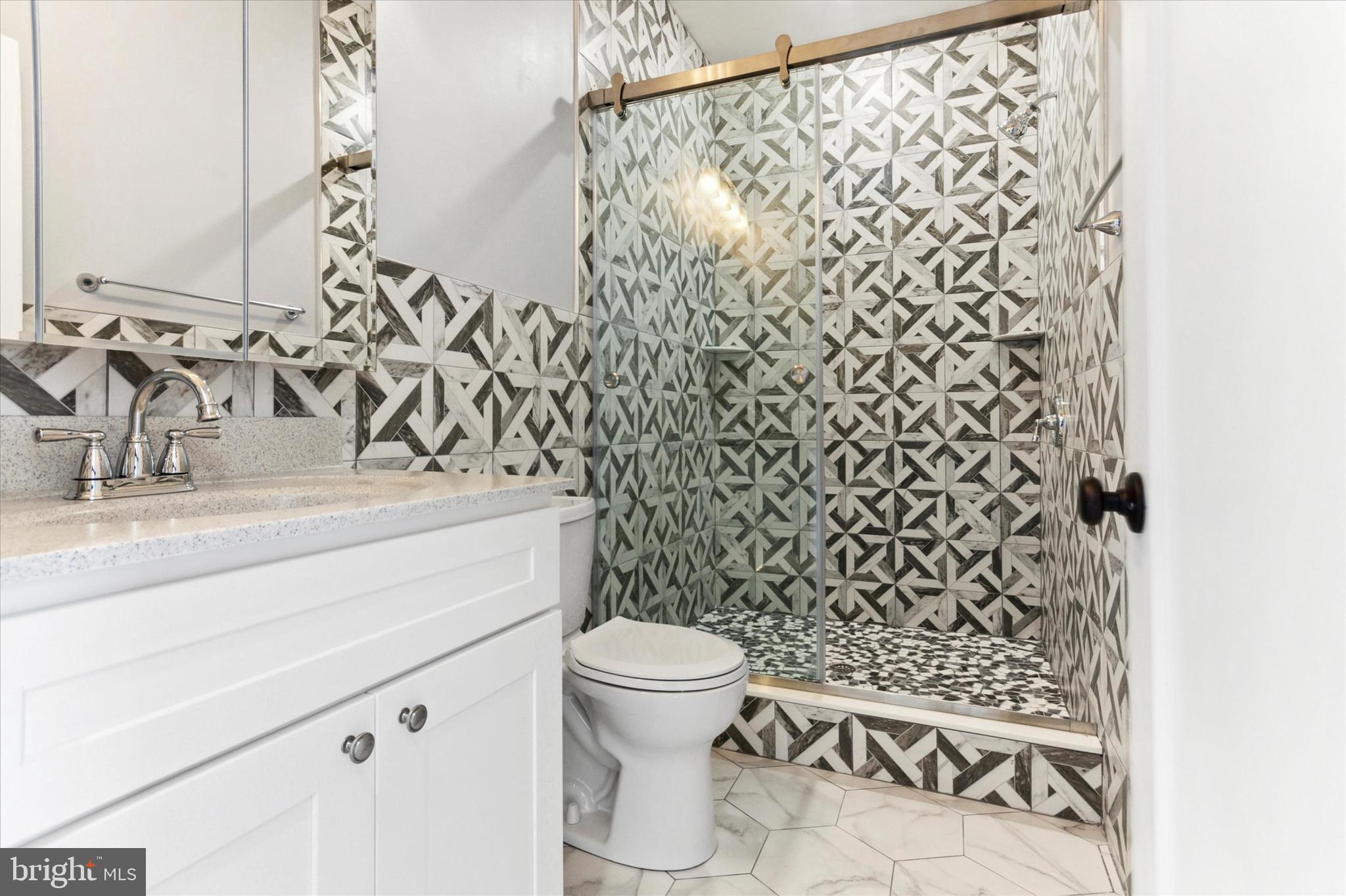 650 South Street, Unit 3 Philadelphia, PA 19147 - Photo 9 of 13 a bathroom with a toilet and a sink