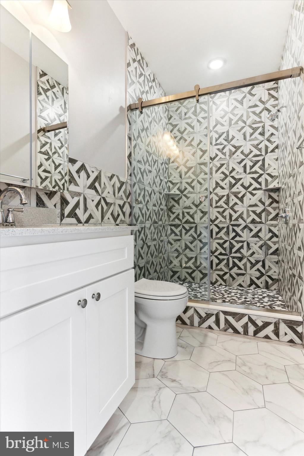 650 South Street, Unit 3 Philadelphia, PA 19147 - Photo 10 of 13 a bathroom with a toilet and a shower curtain