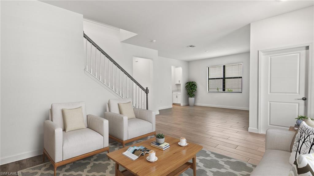 21090 Verawood Loop Estero, FL 33928 - Photo 6 of 17 a living room with furniture and wooden floor