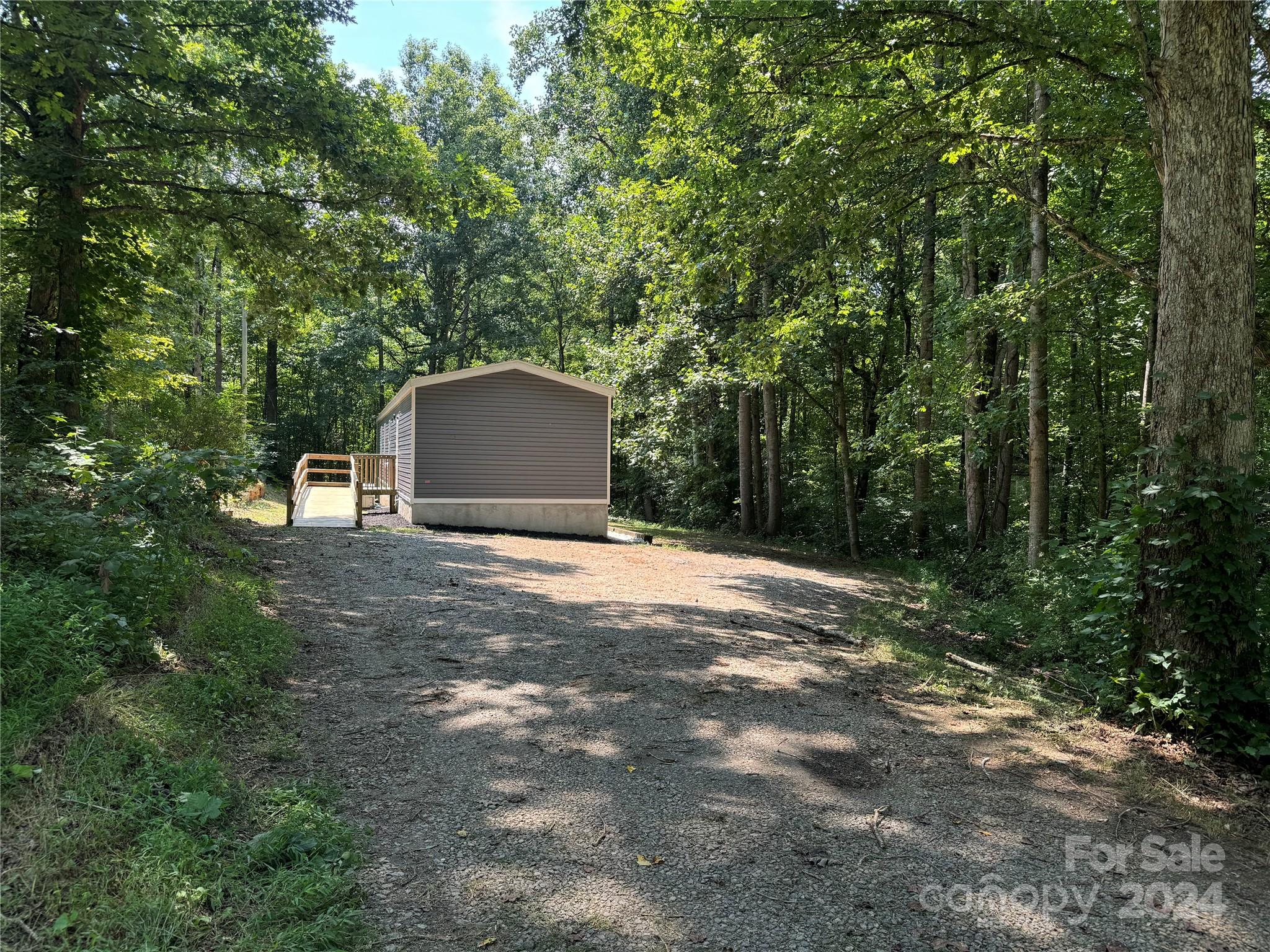 4730 Crystal Creek Road Morganton, NC 28655 - Photo 6 of 17 a view of a backyard with a trees